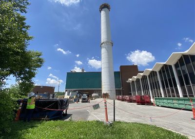 Photo of site and stack before demolition and construction.