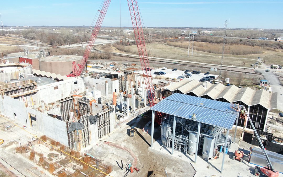 An aerial view of site construction progress and vertical development on building structures.
